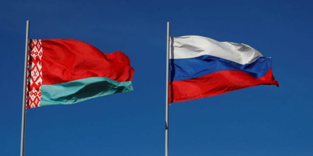 The flag of Belarus flies closely to the flag of Russia